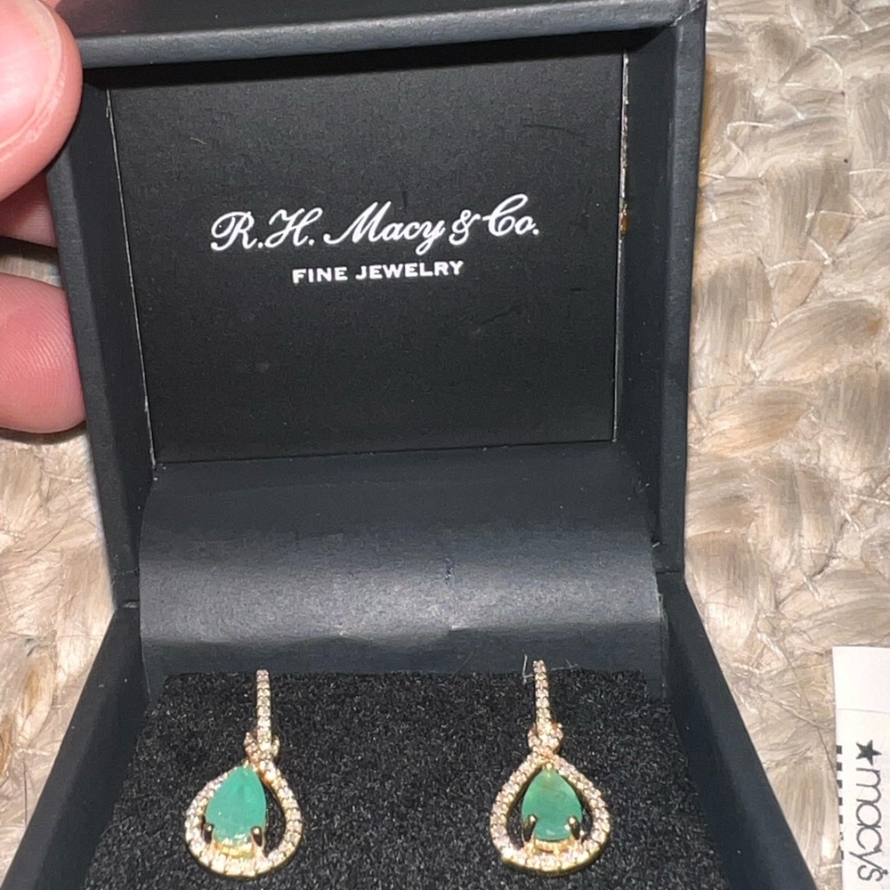 Emeralds and diamonds on 14K gold.